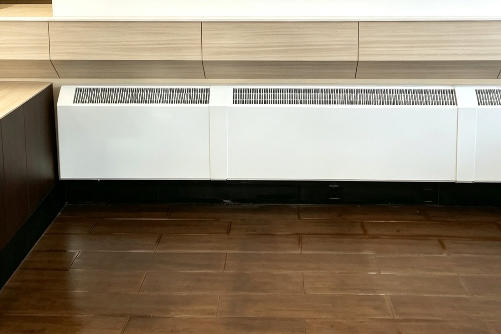 White convectors integrated beneath an interior window ledge