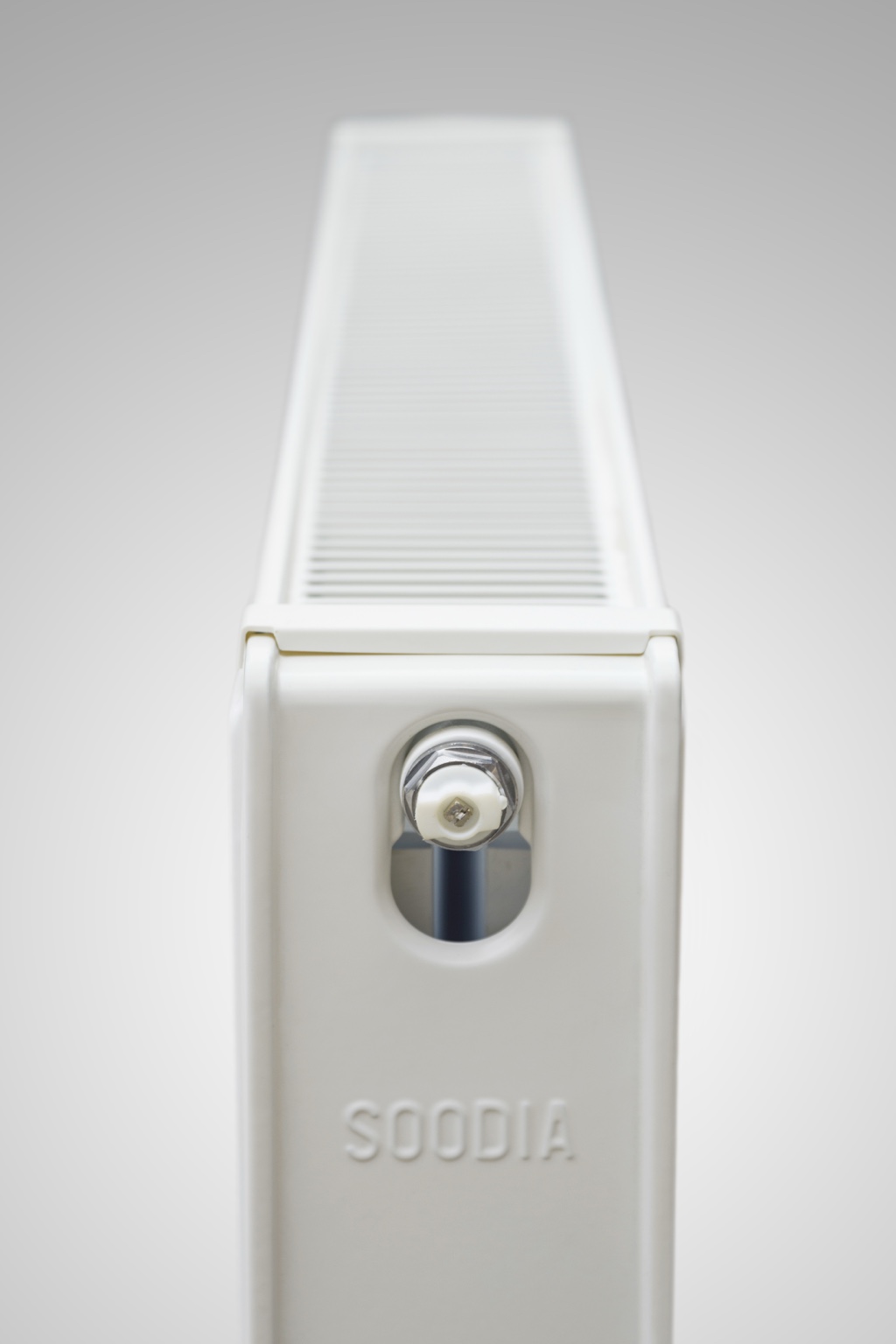 Steel panel radiator end view showing the top grille and SOODIA branding
